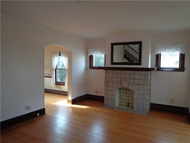 Living Room. Gleaming hardwood floors in charming