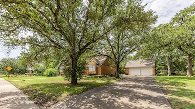 Obstructed view of property featuring a front yard
