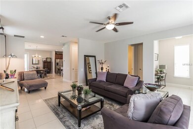 Open floor plan living room flowing into dining ro