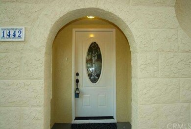 Beautiful  arched entry and porch, boasting new en