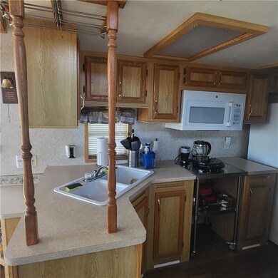 Kitchen has microwave & hot plate.  Good cabinet s