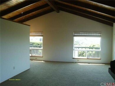 Kitchen is to left of wall.