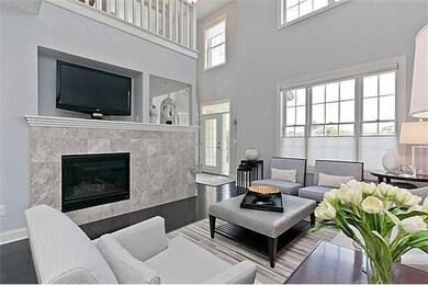 Living Room. More windows & Upgraded fireplace sur