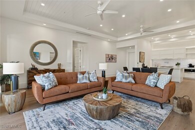 Living room featuring light wood-type flooring, ba