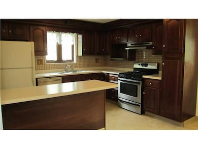 Land. cherry cabinetry.. easy care flooring.. cera