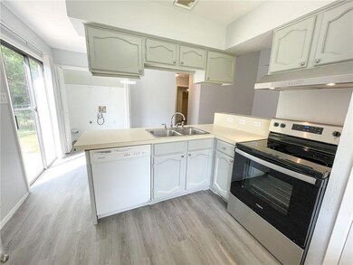 Kitchen featuring stainless steel electric range,