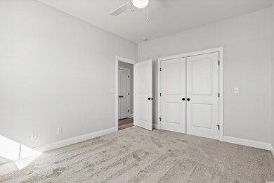 Unfurnished bedroom featuring carpet floors, a clo