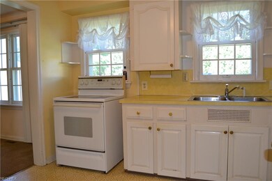 Kitchen is fully applianced and opens to the dinin