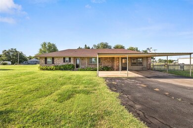 Single story home with a front lawn