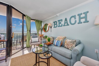 Tiled living area featuring ornamental molding and a water view