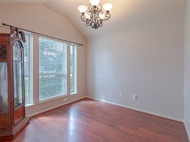 Another view of the front office or formal living/dining. Notice the laminate flooring! This home has no carpet throughout.