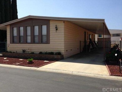 Carport can fit 2 cars! See storage shed in rear!