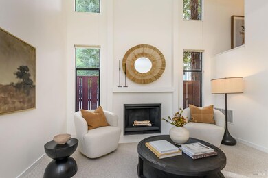Living room with vaulted ceiling and fireplace