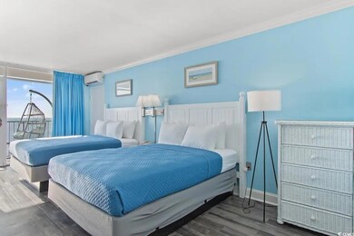 Bedroom featuring wood-type flooring, a wall mount