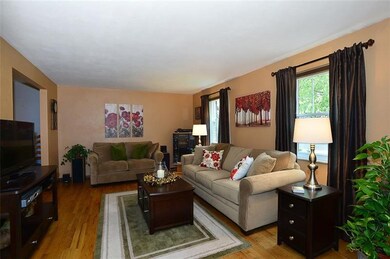 Formal living room with neutral paint, hardwood fl