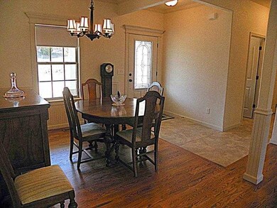 Dining Room. The beautifully coordinated finishes complement each other beautifully~ wainscot, wood, tile.