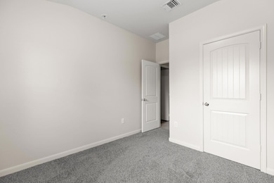 Unfurnished bedroom featuring carpet floors and b