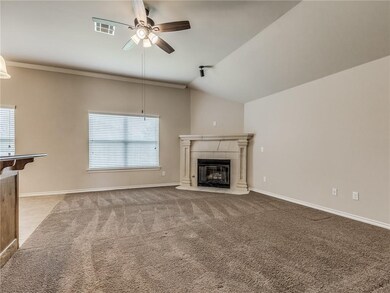 Living room is open to the kitchen & has a gas fir