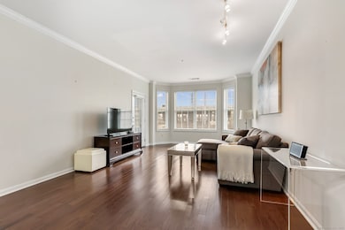 Spacious living room with plenty of sunlight and w