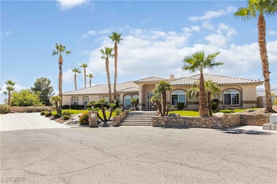 Mediterranean / spanish home featuring a chimney, a tile roof, and stucco siding