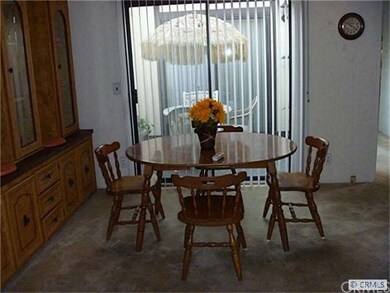 View from Kitchen to Dining Room with Atrium behin