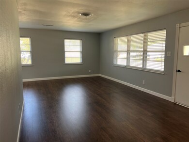 Spacious, bright living room with large windows, n