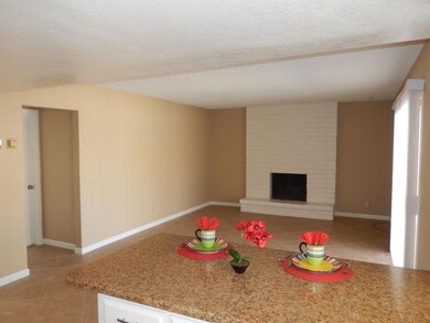 Kitchen Opens to Family Room w/Fireplace