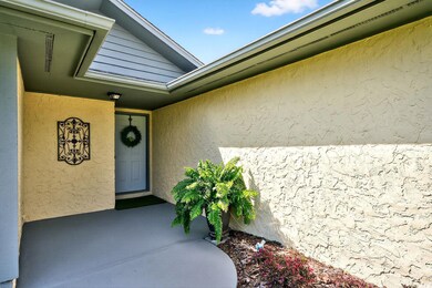 Doorway to property with stucco siding