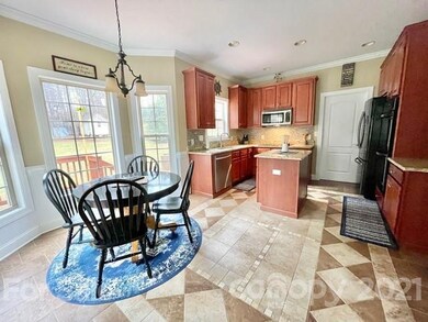 Large kitchen with custom tile flooring