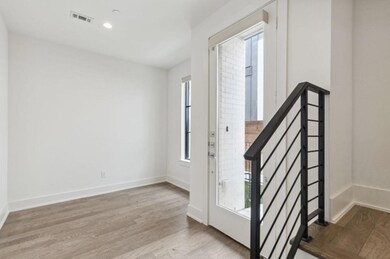 Foyer featuring a healthy amount of sunlight and light hardwood / wood-style flooring