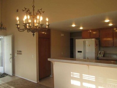 Dining room view toward kitchen with scraped ceili