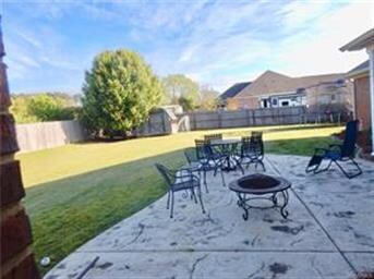 Large patio area off covered porch.