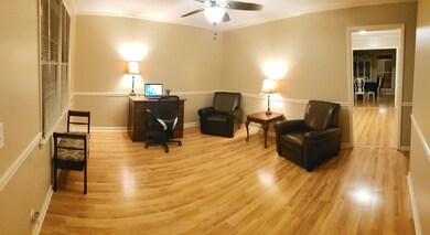 Front room currently used as an office, could be a formal living room.