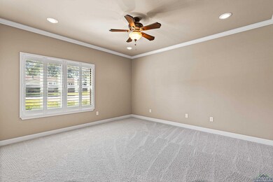 Unfurnished room featuring carpet floors, ornament