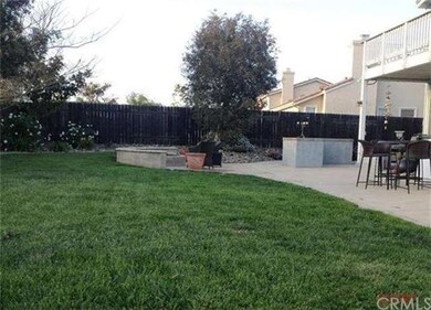 Backyard showing fire pit, BBQ and Balcony off Mas
