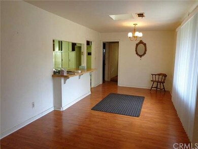 Dining room with kitchen bar and skylight.  