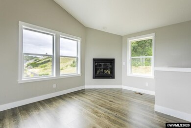 With gas fireplace and open concept.