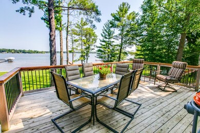 Spacious deck overlooking lakeshore.