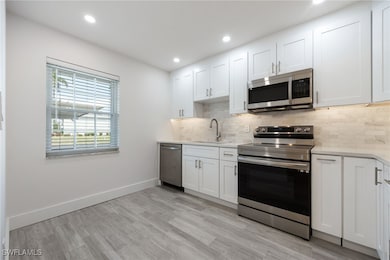 Kitchen featuring appliances with stainless steel