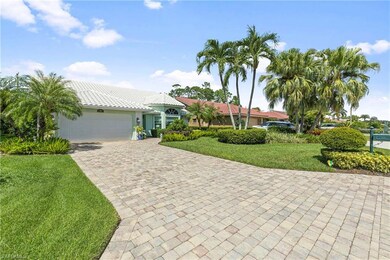 Mediterranean / spanish-style house featuring a front lawn, decorative driveway, a garage, and stucco siding