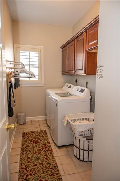 Separate downstairs laundry room. washer/dryer rem