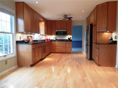 Kitchen has a large eating area by the window.