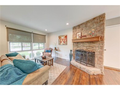 Cozy Fireplace and Roman Shades