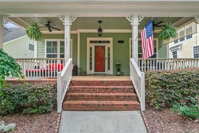 Large front porch looks directly into Forest Park.