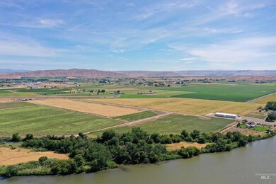 Overview of rural landscape featuring mountains and extensive farmland