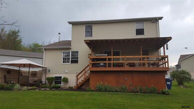 Big covered deck overlooking 1/2 acre lawn