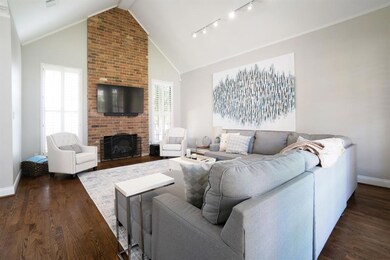 Fireplace, tall ceilings, rich wood floors  add to