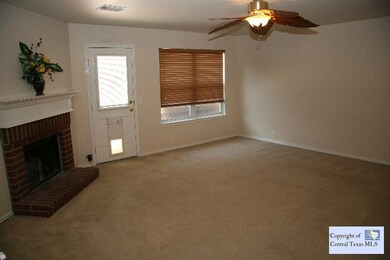 Living Room: Downstairs open floor plan with firpl