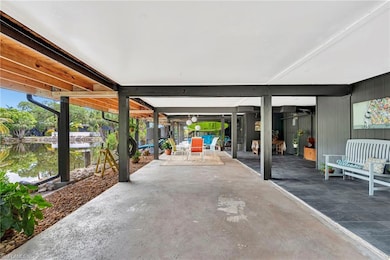 Large carport with multiple uses  Furnished with two 10' kayaks & ladies bike.