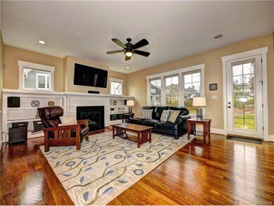 Built-in shelving surrounds the fireplace, and upg